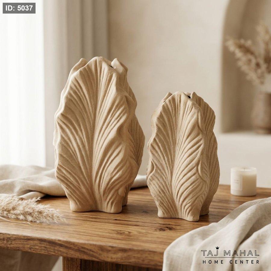 A wide leaf-shaped resin decorative vase
