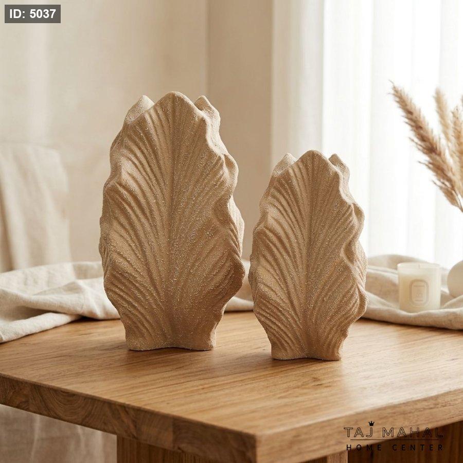 A wide leaf-shaped resin decorative vase
