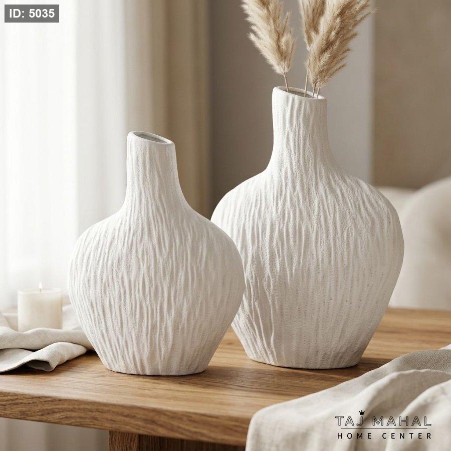 White ceramic vase with stone relief