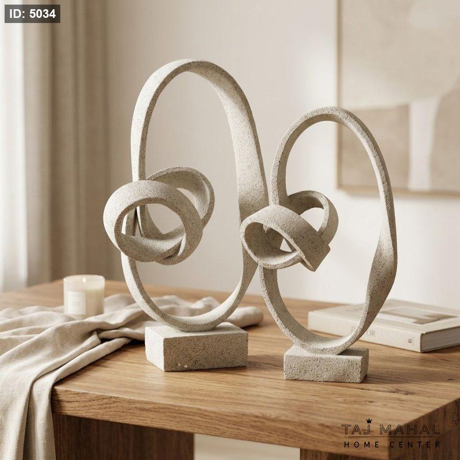 Abstract resin decorative figurine with interlocking spiral knot design