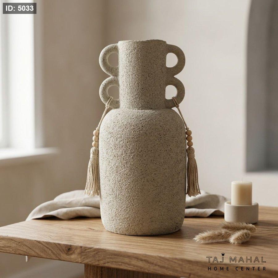 Decorative pottery vase with a rough sandy texture