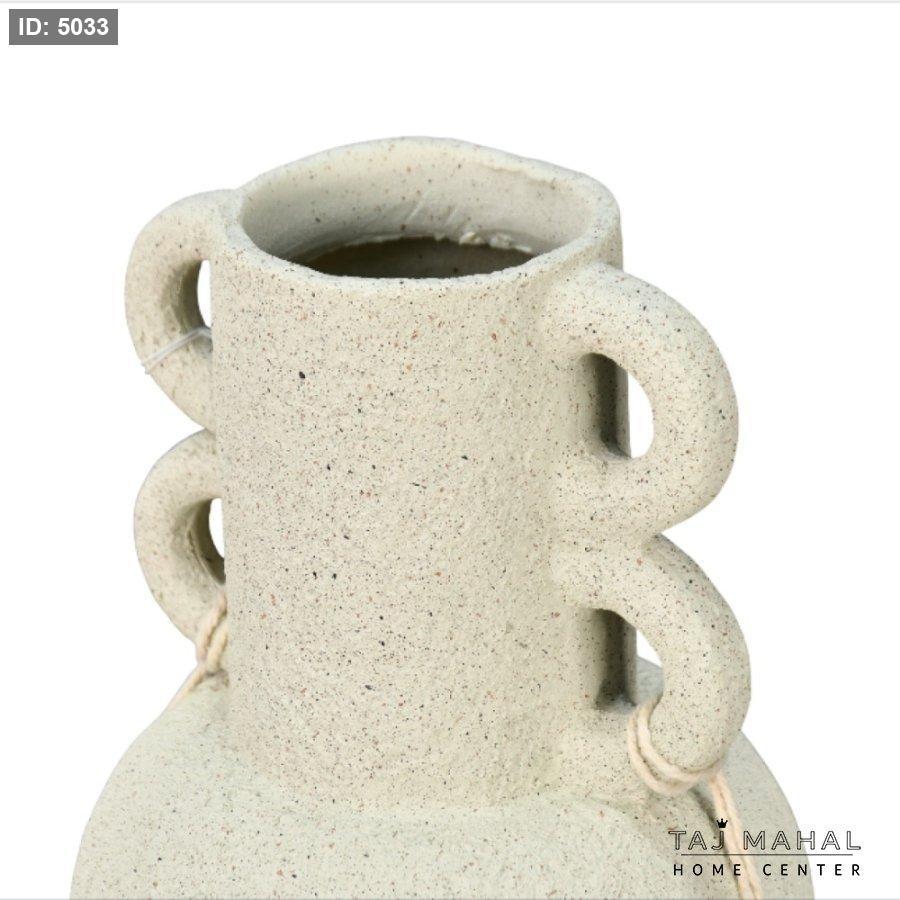 Decorative pottery vase with a rough sandy texture