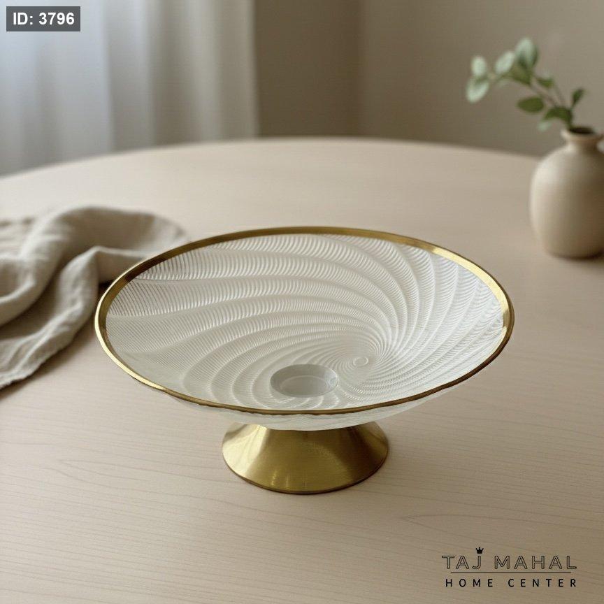 Glass fruit bowl with gold base and rim