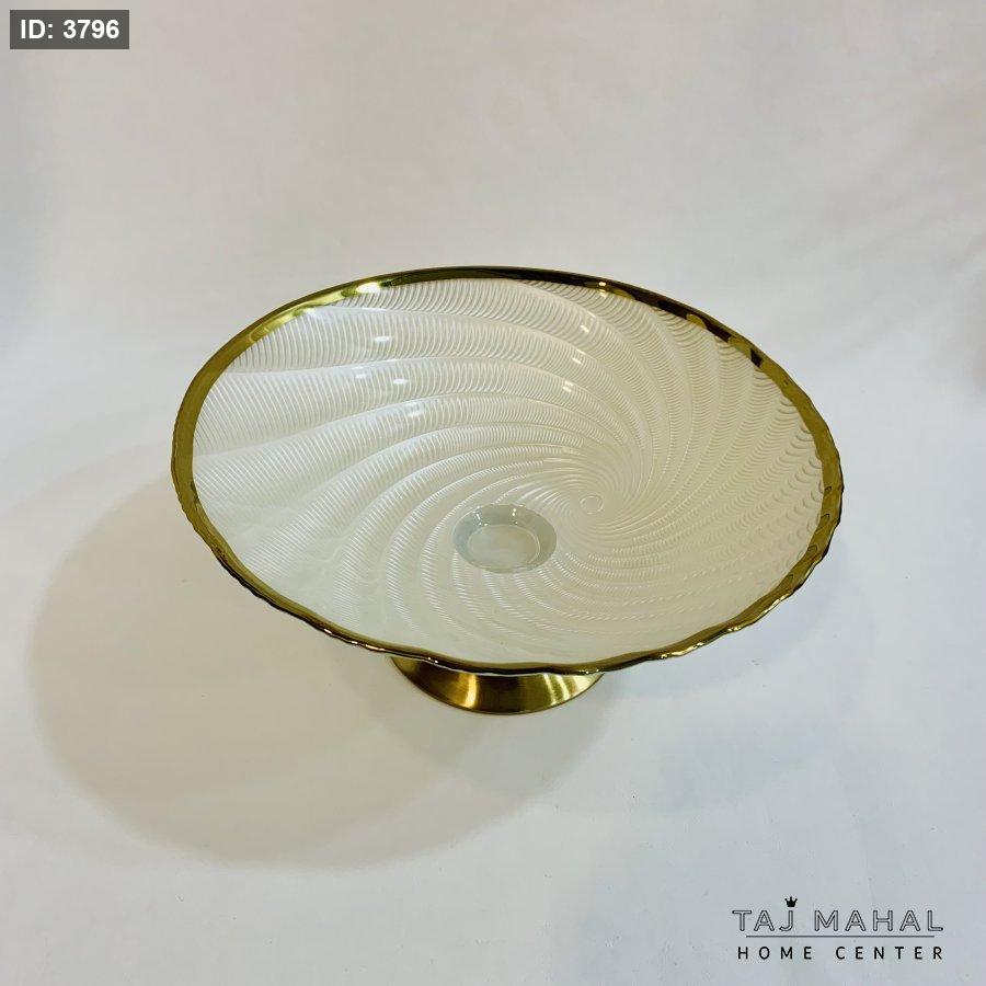 Glass fruit bowl with gold base and rim