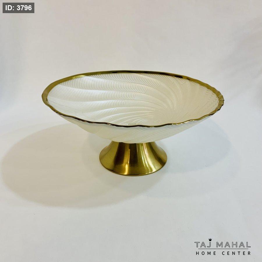 Glass fruit bowl with gold base and rim