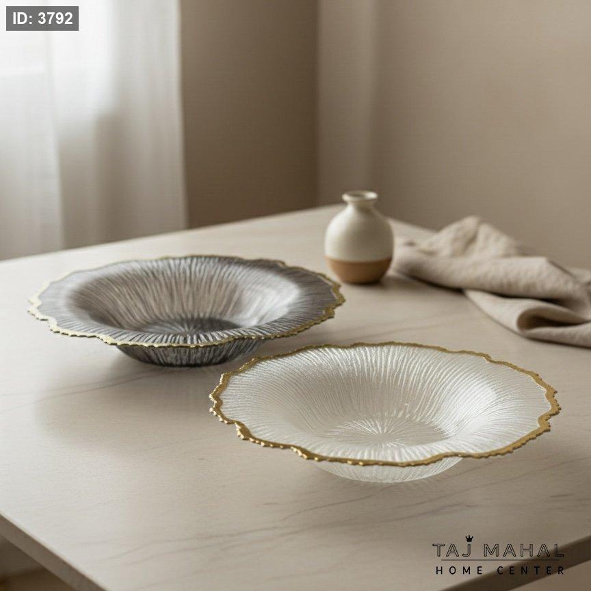 Glass fruit plates with a wavy design and a gold rim