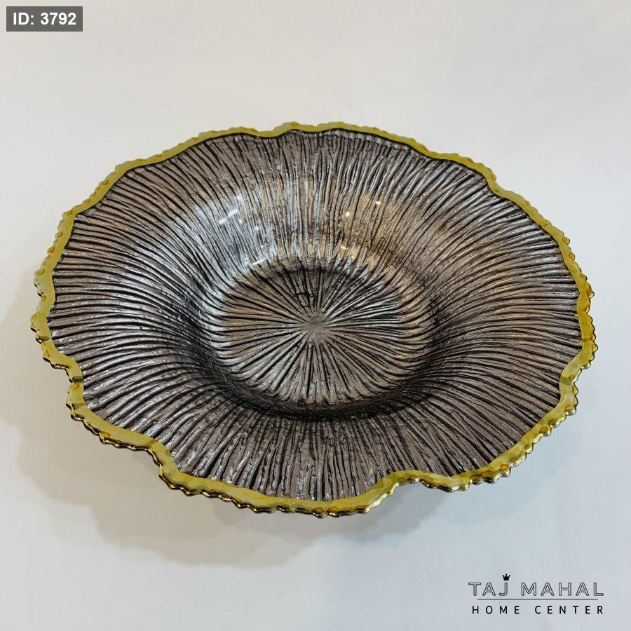 Glass fruit plates with a wavy design and a gold rim