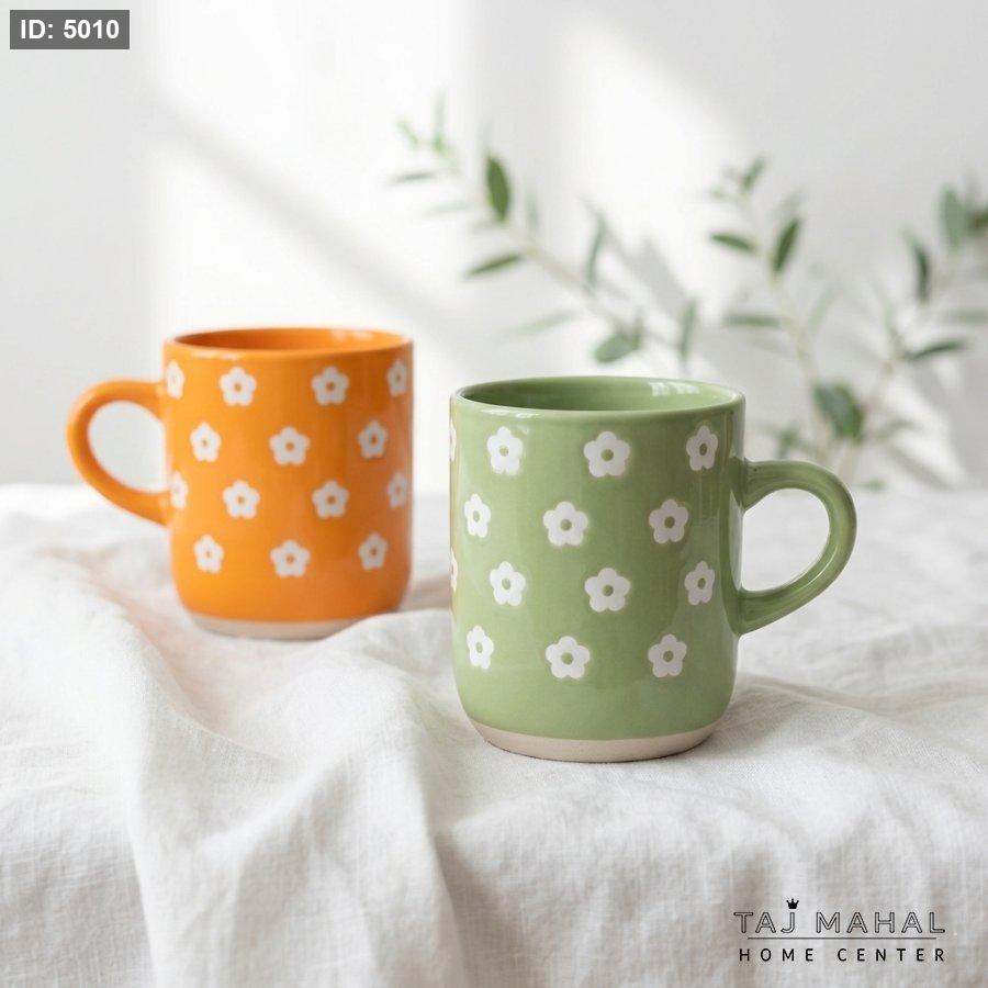 Green porcelain mug with white floral pattern