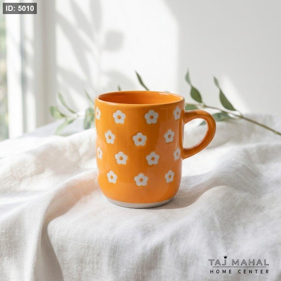 Green porcelain mug with white floral pattern