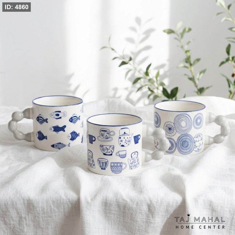 White ceramic mug with cute blue drawings
