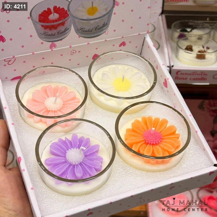 Rose shaped scented decorative candles in a glass cup