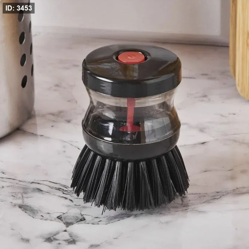 Dish washing brush with detergent reservoir