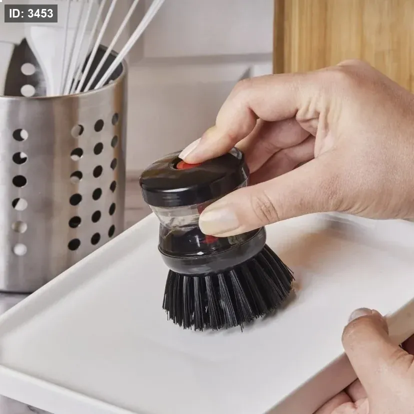 Dish washing brush with detergent reservoir